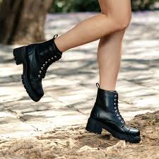 People struggle against the wind and rain in Malmö, Sweden, after a storm reached southern Sweden, Saturday Oct. 4, 2025. (Johan Nilsson/TT via AP)